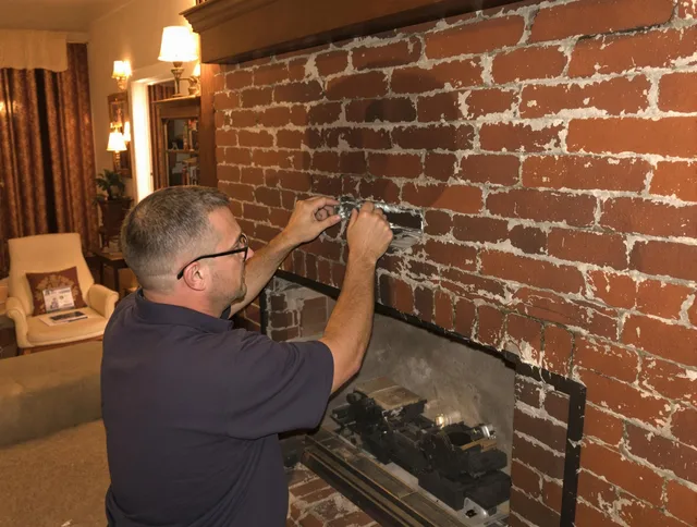 Glendale Chimney Sweep expert fixing a fireplace in Glendale, CA